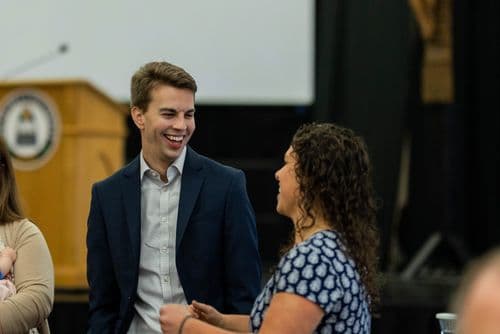 Institute scholars at a professional alumni event